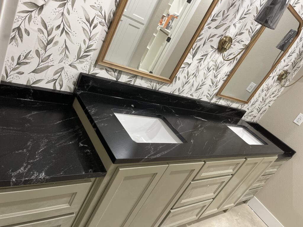 bathroom countertop with granite and custom cabinets